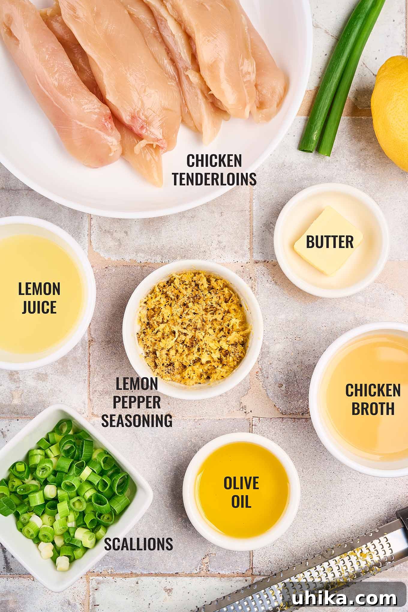 Crispy Lemon Pepper Chicken Strips 3 Ingredients to make lemon pepper chicken tenders on a tiled background, including chicken tenderloins, butter, lemon juice, lemon pepper seasoning, and more.