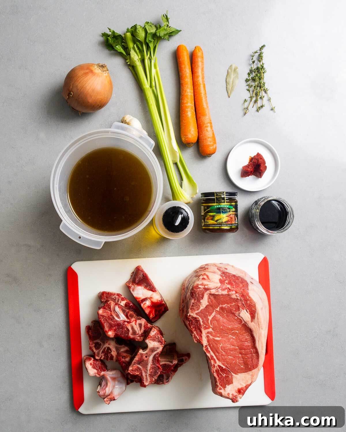 Tender Prime Rib with Rich Beef Drippings 3 Ingredients shown: onion, celery, carrots, bay leaf, thyme, beef stock, olive oil, beef base, red wine, tomato paste, beef bones, and prime rib.