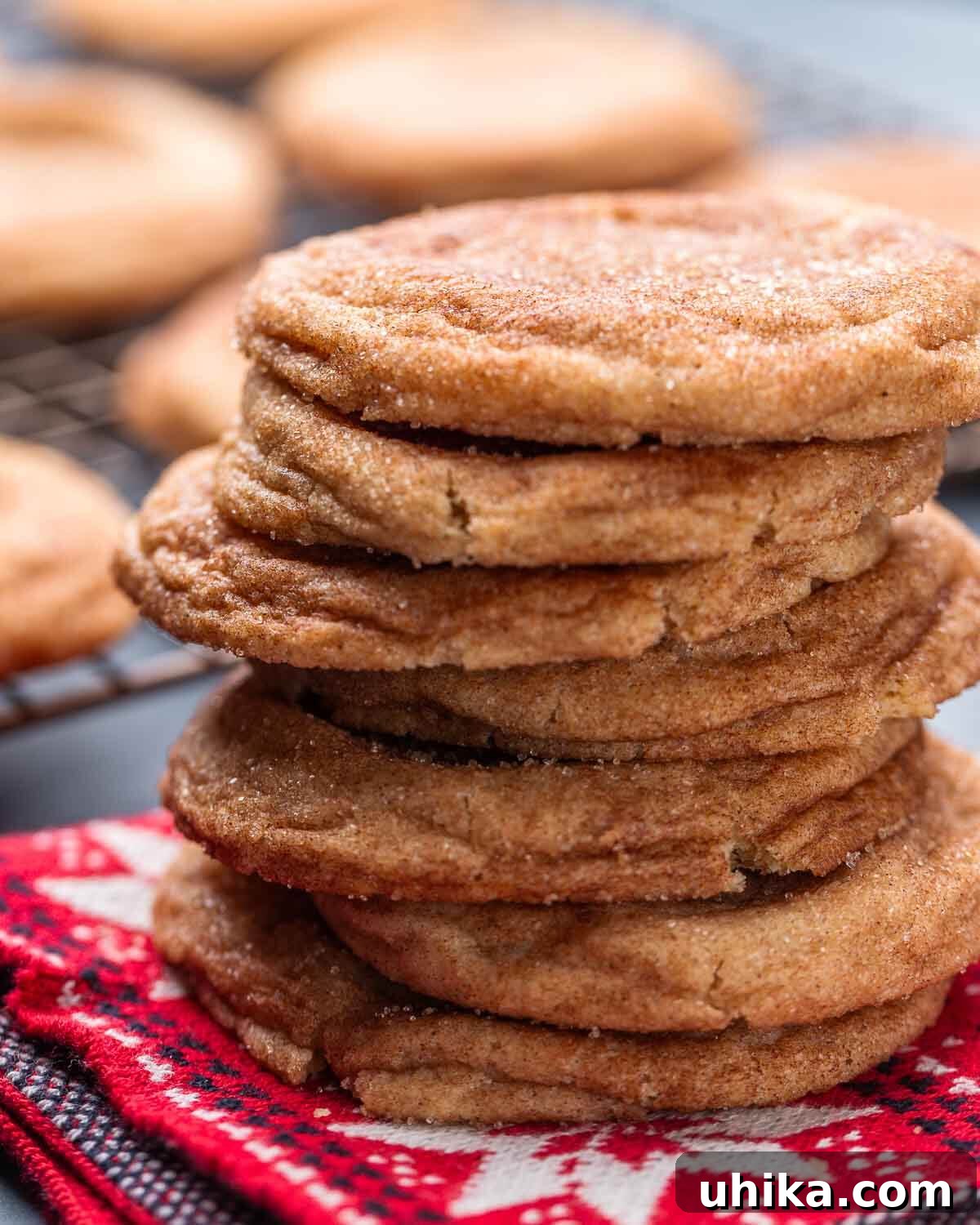 Melt In Your Mouth Fluffy Snickerdoodles 8 Stack of snickerdoodles on red napkin.