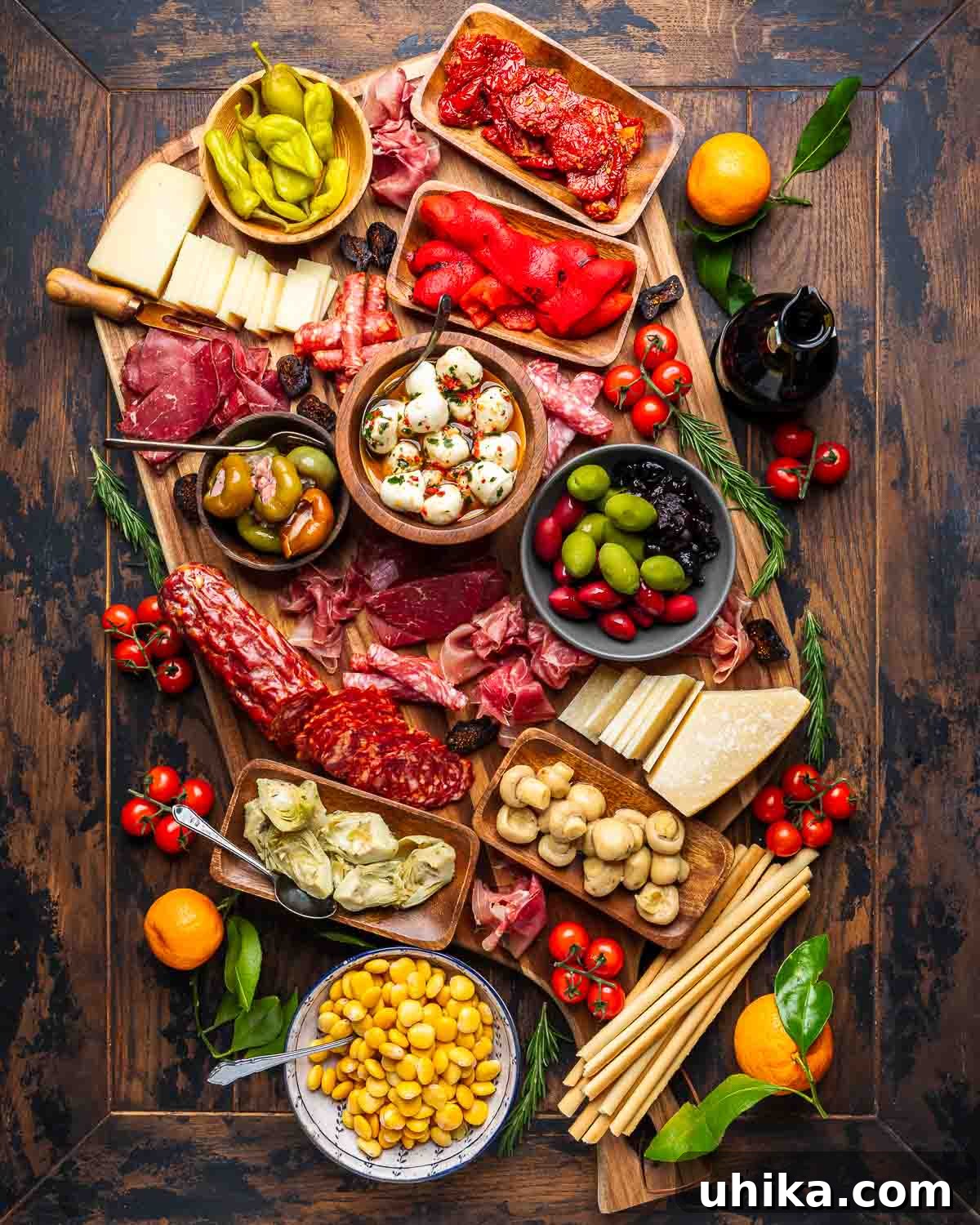 Crafting the Ultimate Antipasto Board 2 Large antipasto platter with a rich assortment of cured meats, cheeses, olives, and pickled vegetables, ready for guests.