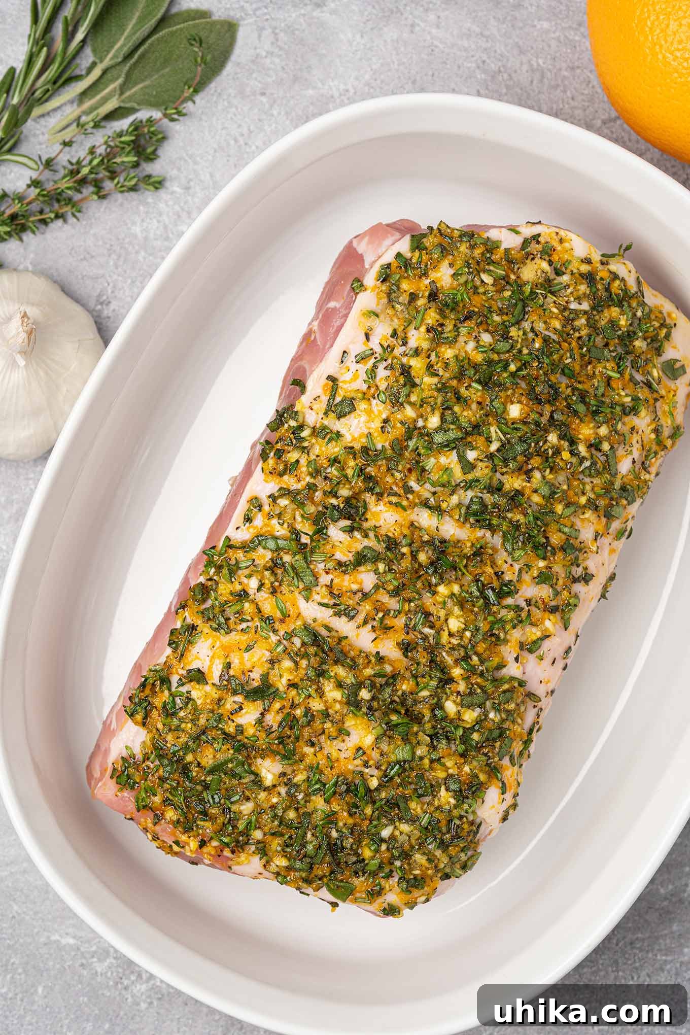 Golden Herb Crusted Pork Loin 4 A boneless pork sirloin roast coated with garlic and herb rub and ready to go into the oven.