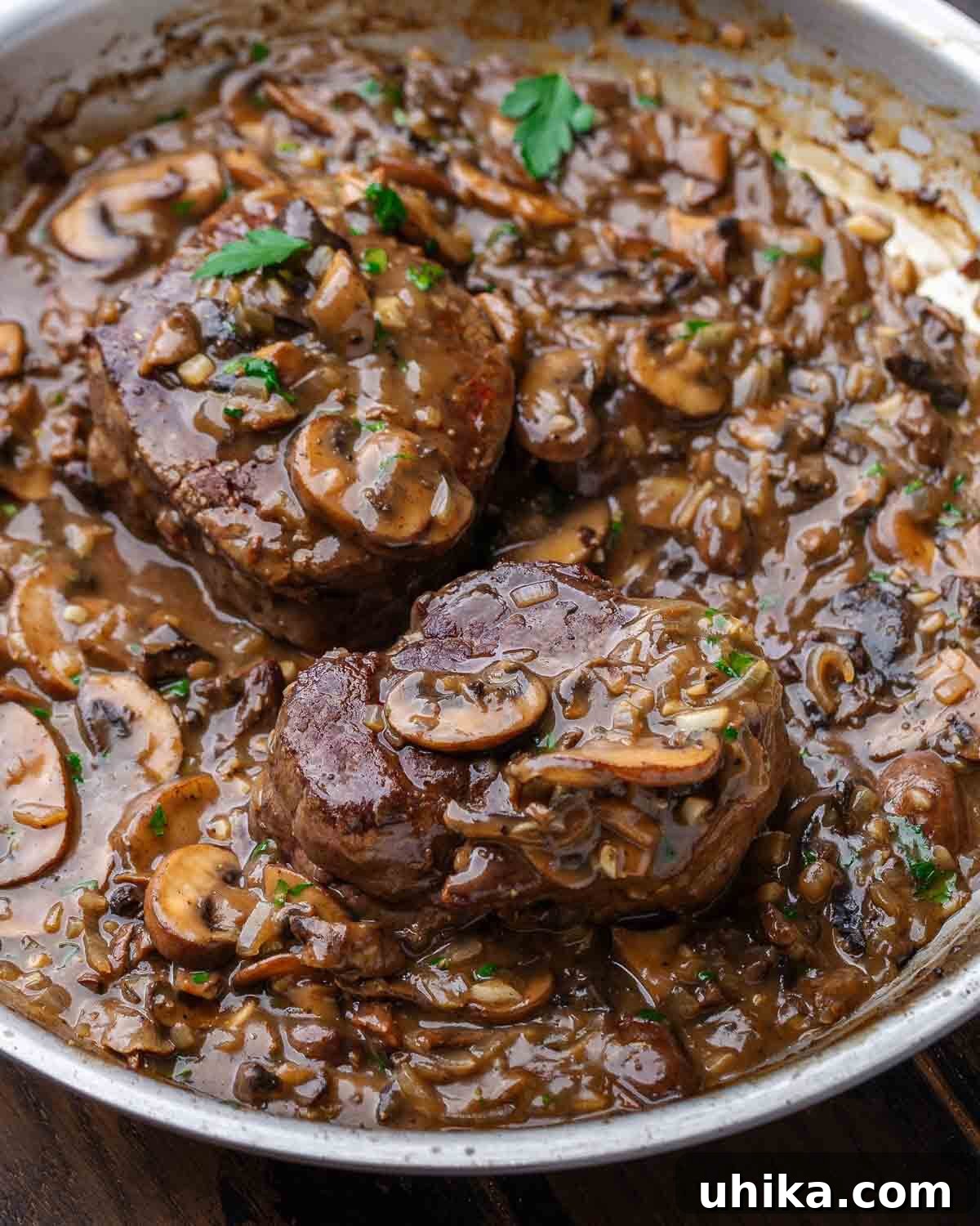 Rich Marsala-Braised Beef 7 A large pan filled with Beef Marsala, showcasing the tender steak generously covered in a rich, dark mushroom and Marsala wine sauce, ready to be served.