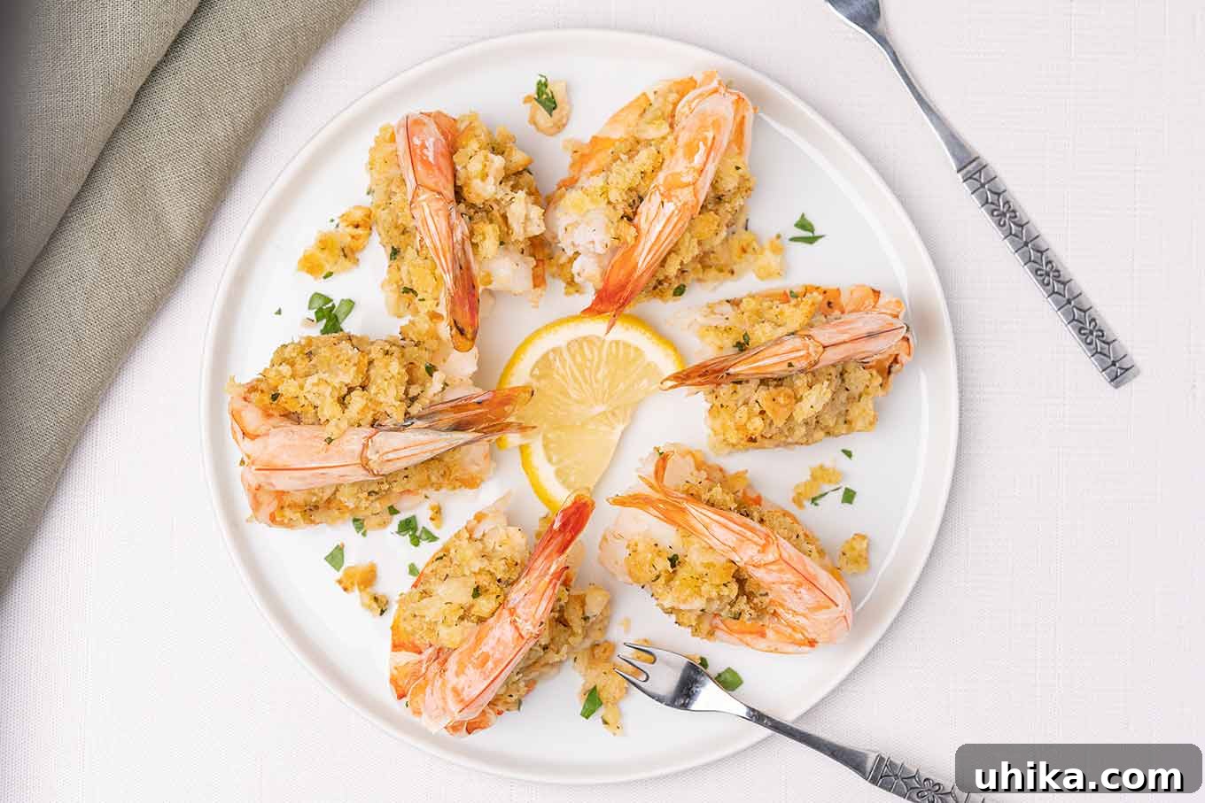 Oven-Baked Shrimp Treasures 5 Six baked stuffed shrimp, ready to serve, with lemon wedges, seafood forks and linen napkins. A perfect dish for any special occasion.
