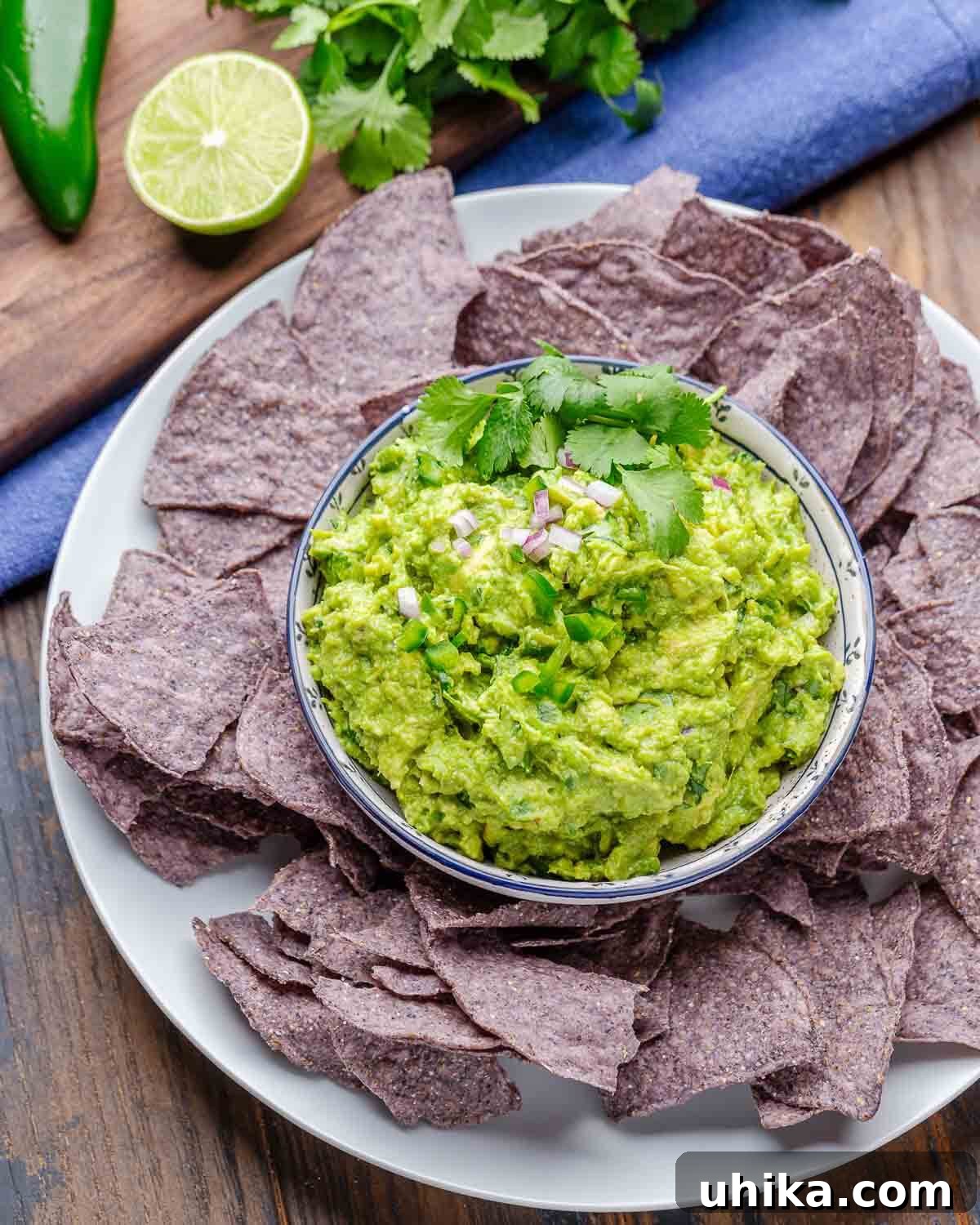 Guacamole Perfection 7 Large platter with bowl of guacamole and tortilla chips.