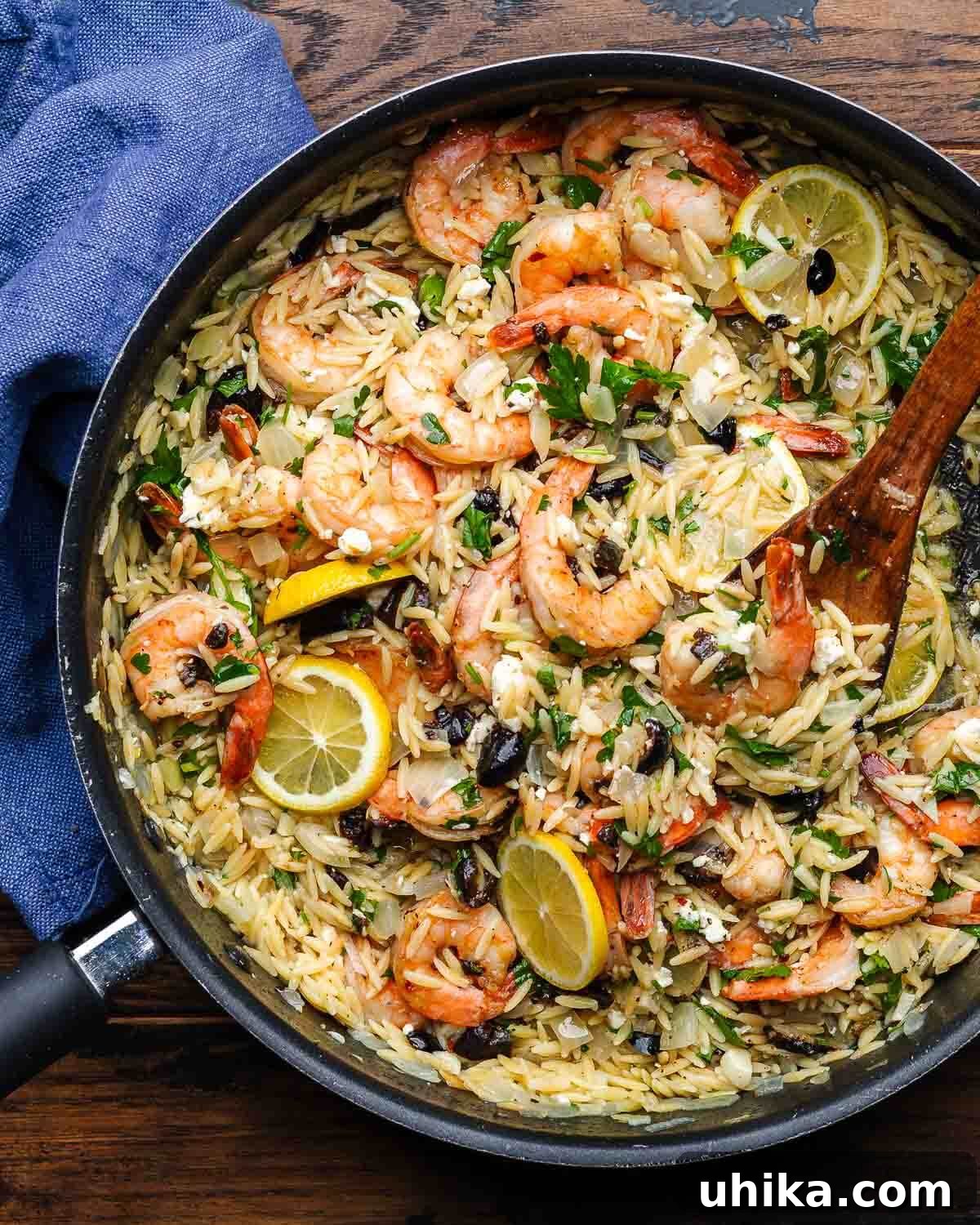 Mediterranean Shrimp and Feta Orzo 2 Large pan with orzo and shrimp with feta and black olives.