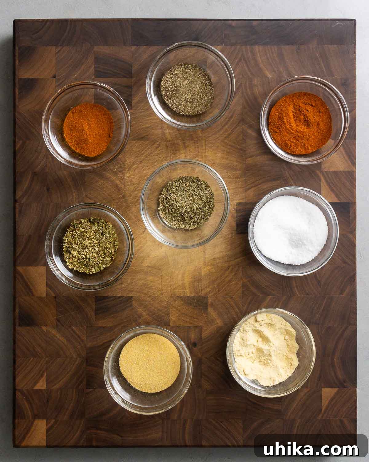 Spice of the Bayou 2 Ingredients shown: Paprika, Diamond crystal kosher salt, onion, powder, granulated garlic, dried oregano, dried thyme, black pepper, and cayenne.