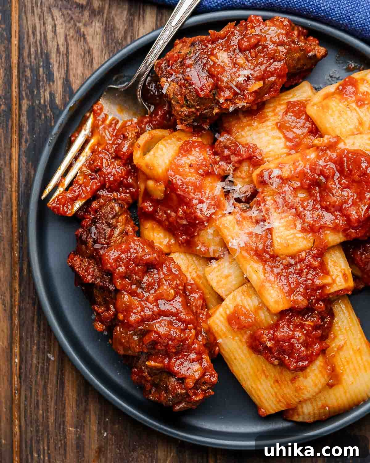 The Rise and Fall of Kitchen Fads 2 Beef braciole in grey plate with pasta, a classic Italian dish.