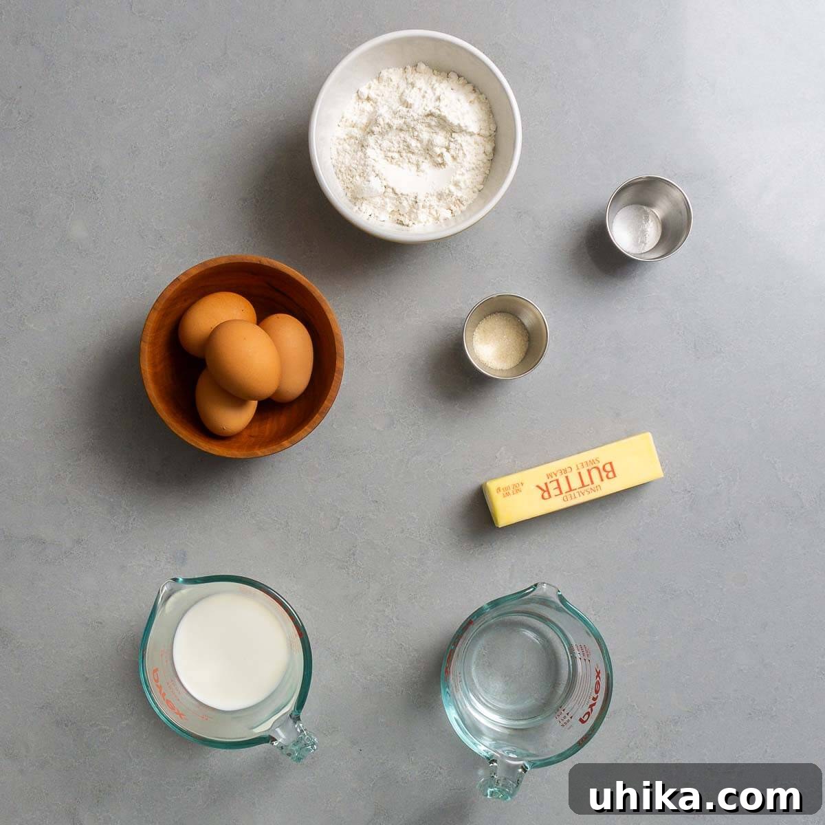 St. Joseph's Day Zeppole 3 Choux pastry ingredients displayed neatly: all-purpose flour, fine sea salt, granulated sugar, fresh eggs, unsalted butter, whole milk, and water.