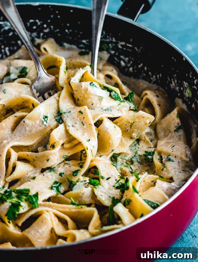 Finished walnut sauce pasta in the pan, ready to be served.