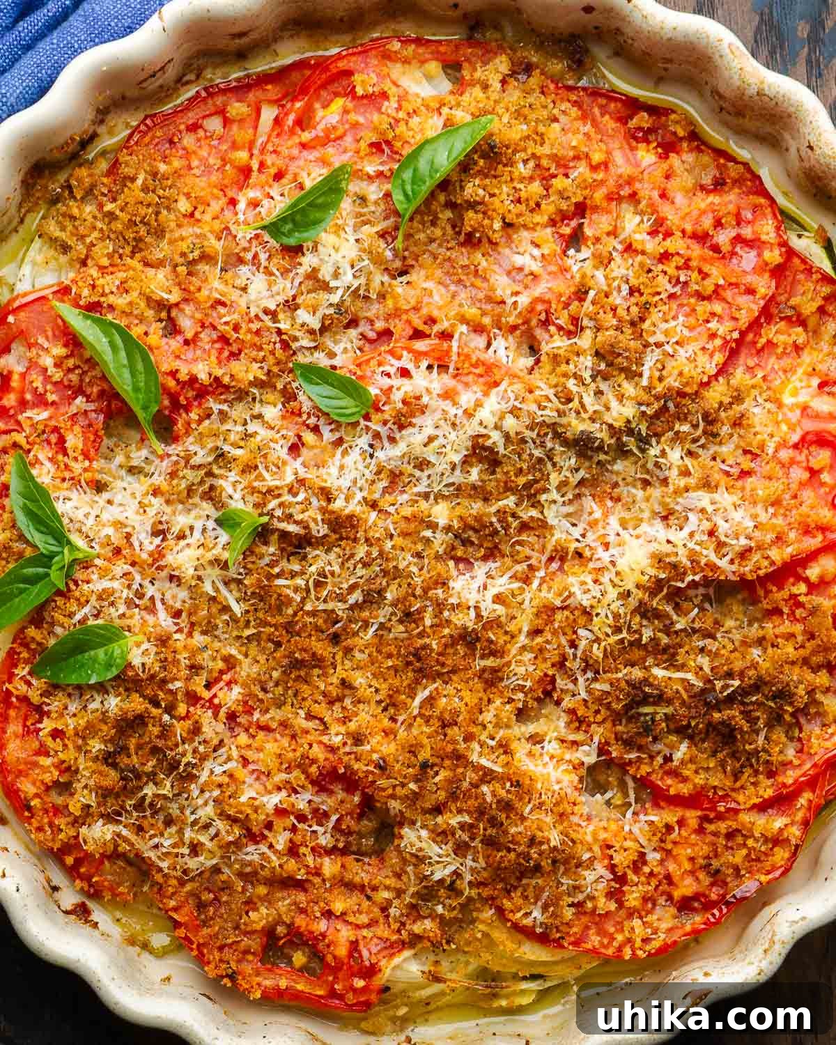Zucchini Parmesan Bake 2 Italian zucchini casserole with toasted breadcrumbs and fresh basil garnish, ready to serve.