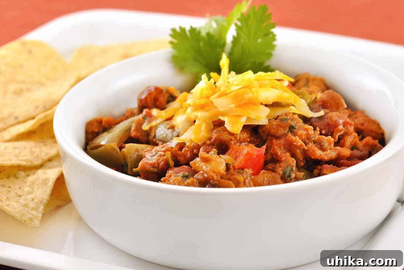 Hearty Turkey Sausage Chili 2 Hearty and Healthy Turkey Sausage Chili, served with cheese and cilantro.