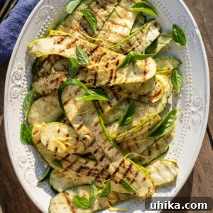 Garlic Herb Grilled Zucchini 6 Grilled zucchini in white platter.