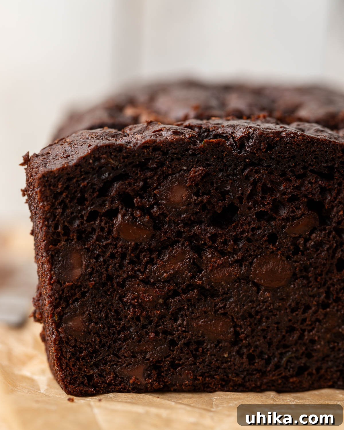 Decadent Chocolate Zucchini Loaf 7 Closeup shot of one slice of chocolate zucchini bread.