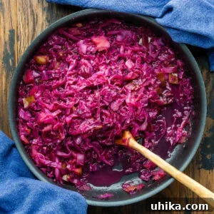 German red cabbage in large black pan with blue towels.