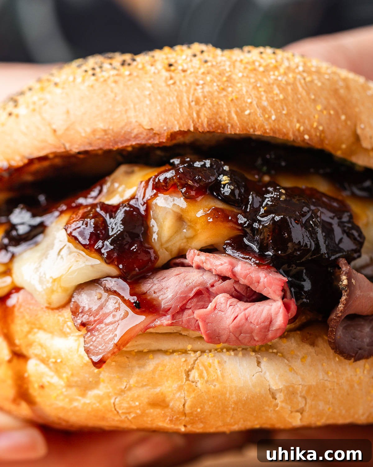 Gourmet Deli Roast Beef 8 Hands holding a delicious homemade roast beef sandwich.