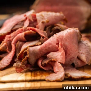 Gourmet Deli Roast Beef 9 Sliced deli roast beef on cutting board.
