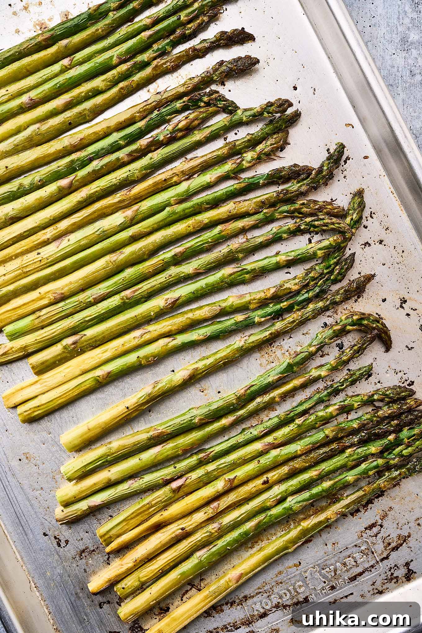 Zesty Lemon Roasted Asparagus 5 A baking sheet with asparagus spears roasted in butter.