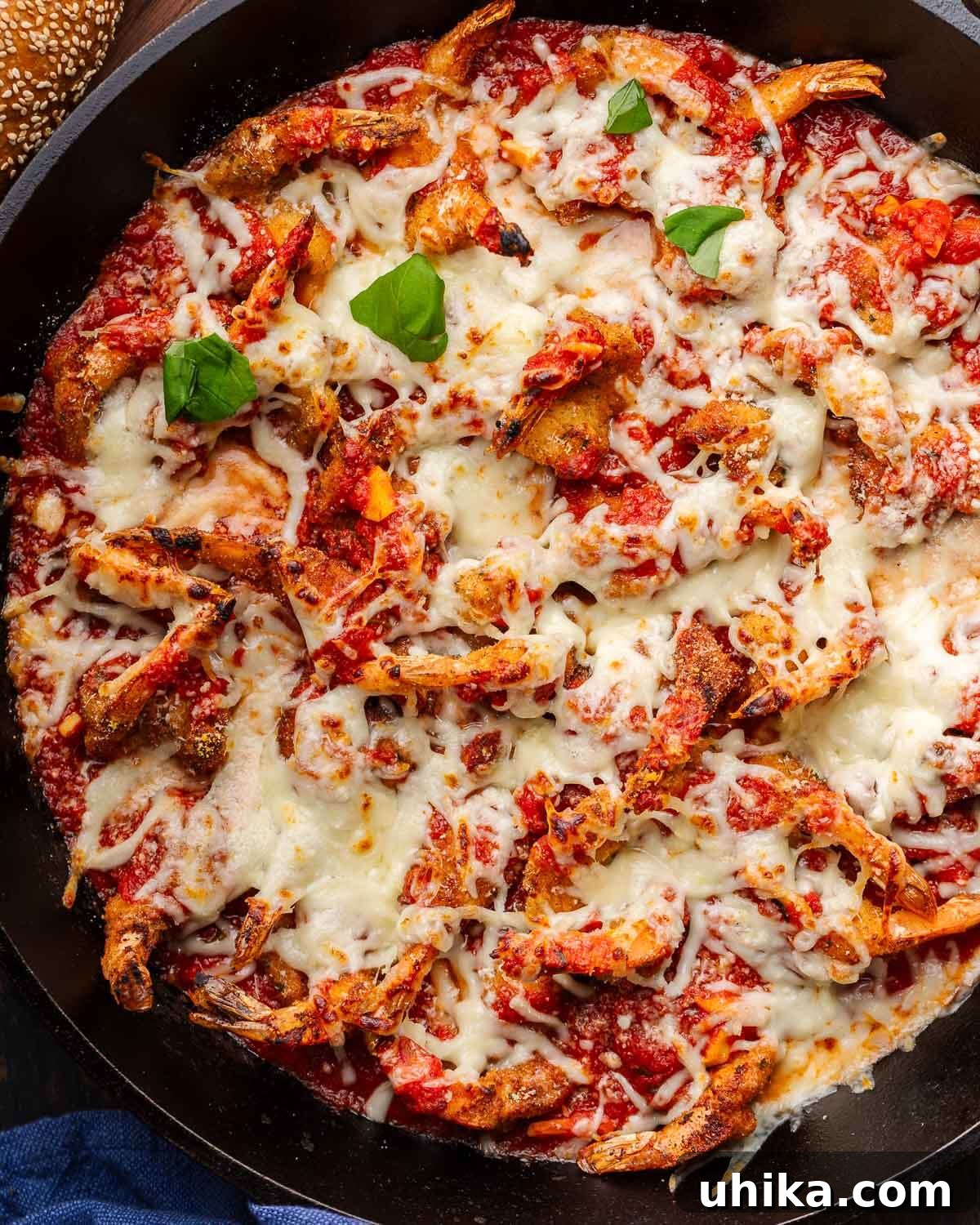 Golden Baked Shrimp Parm 7 Large cast iron pan with shrimp parmigiana.