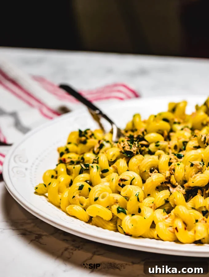 Close-up shot of Tuna Pasta in a serving platter, highlighting the texture and sauce consistency.