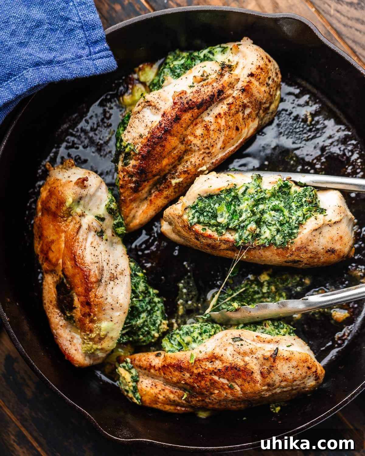 Effortless Spinach Stuffed Chicken 2 Perfectly golden-brown spinach stuffed chicken breasts served in a rustic cast iron pan, ready to be enjoyed.