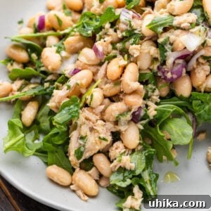 Italian tuna salad with white beans in plate.