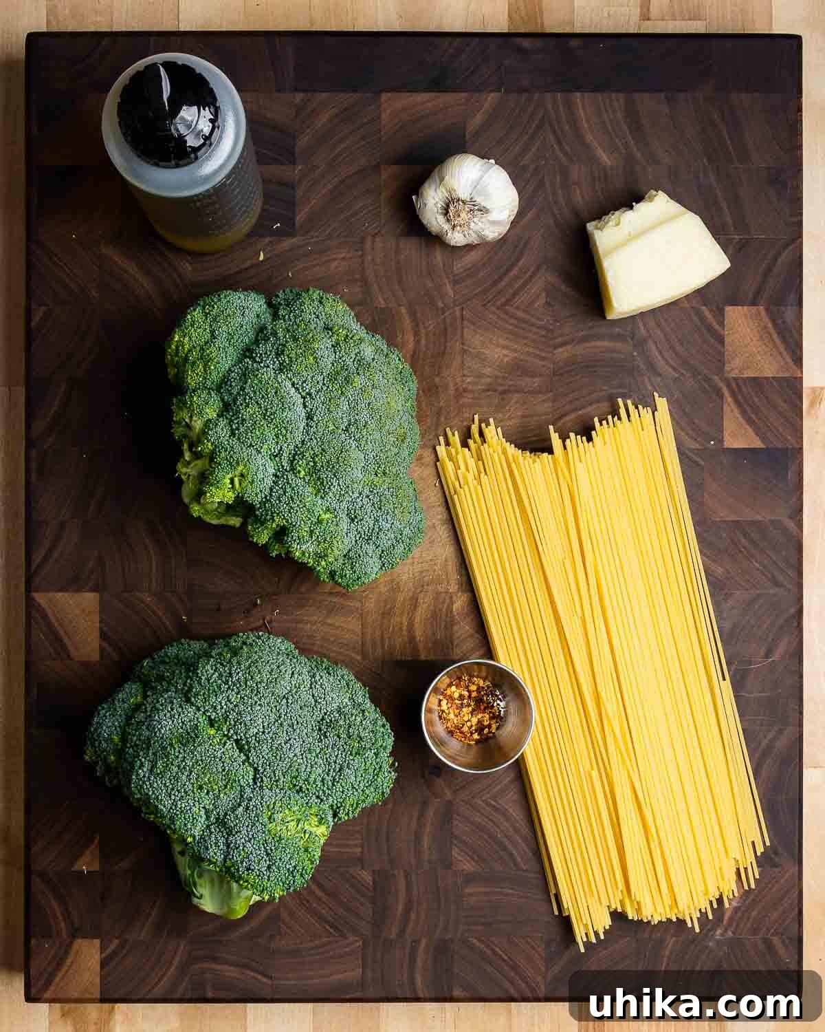 Creamy Broccoli Pasta 3 Essential ingredients for Pasta con Broccoli: fresh broccoli, six cloves of garlic, a bottle of extra virgin olive oil, a wedge of Pecorino Romano cheese, and a handful of red pepper flakes.