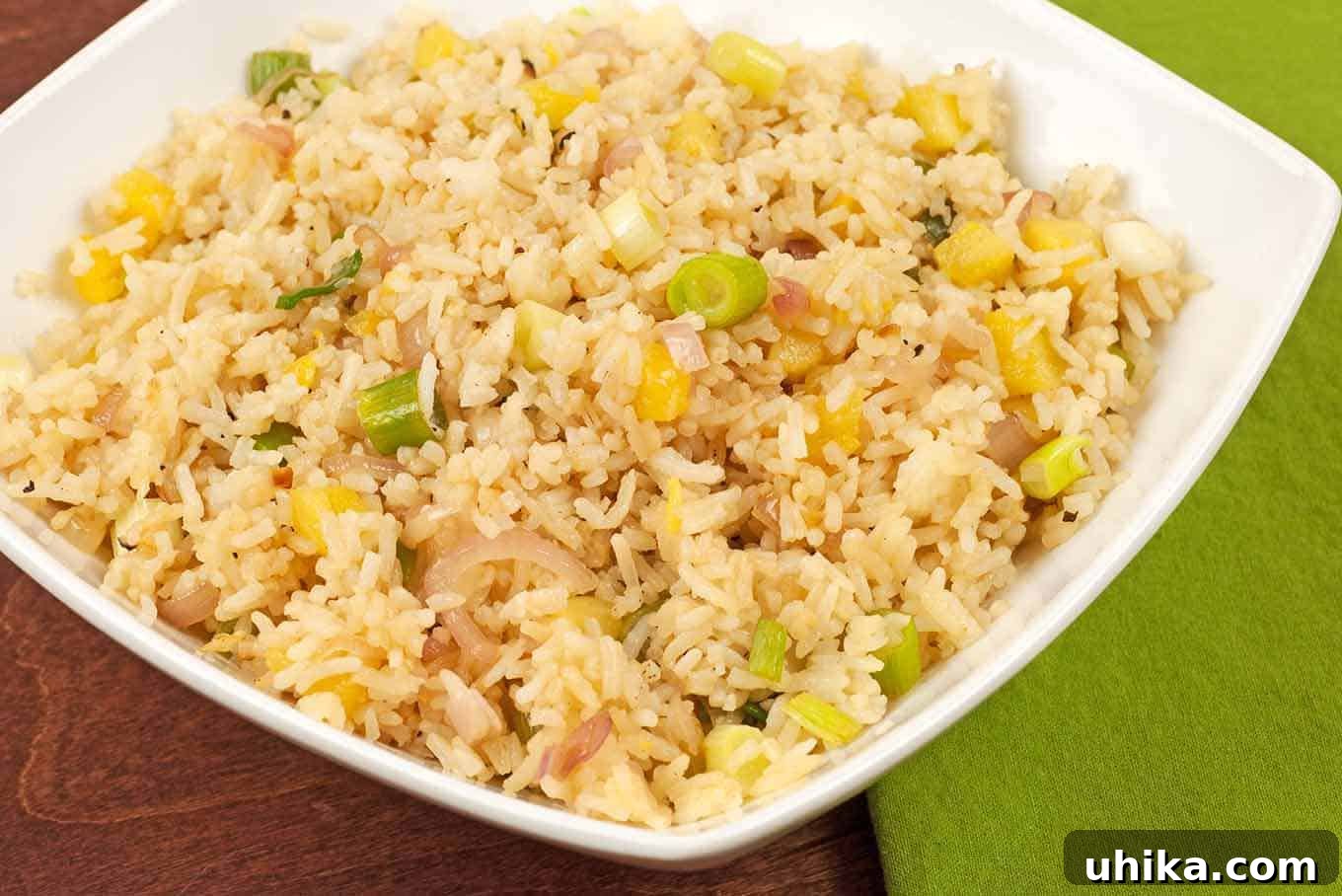 Pineapple Rice - A sweet and savory Vietnamese-inspired side dish with chopped pineapple, sautéed shallots, and fresh scallions, perfect with grilled chicken or fish.