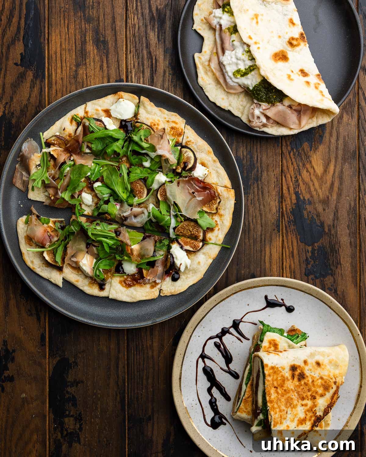 Effortless Pillowy Flatbreads 7 Three flatbreads showcasing different serving ideas: a mortadella sandwich, a fig and goat cheese pizza-style flatbread, and a grilled chicken panini.