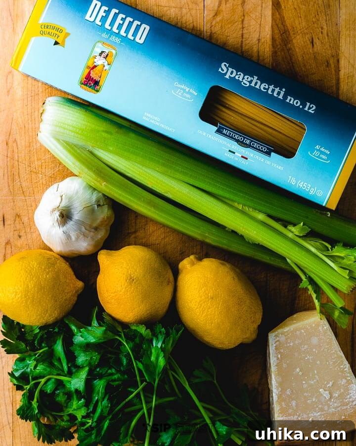 Pasta With Celery - sipandfeast.com #celery #italianpasta #dinner Ingredients shown: pasta, celery, garlic, lemons, parmigiano reggiano and parsley.