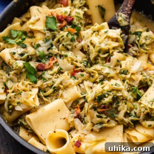 Cabbage bacon pasta in pan.