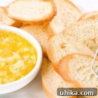 Close-up of Sicilian Lemon Dip in a bowl, garnished with lemon slices and herbs, ready to be served.
