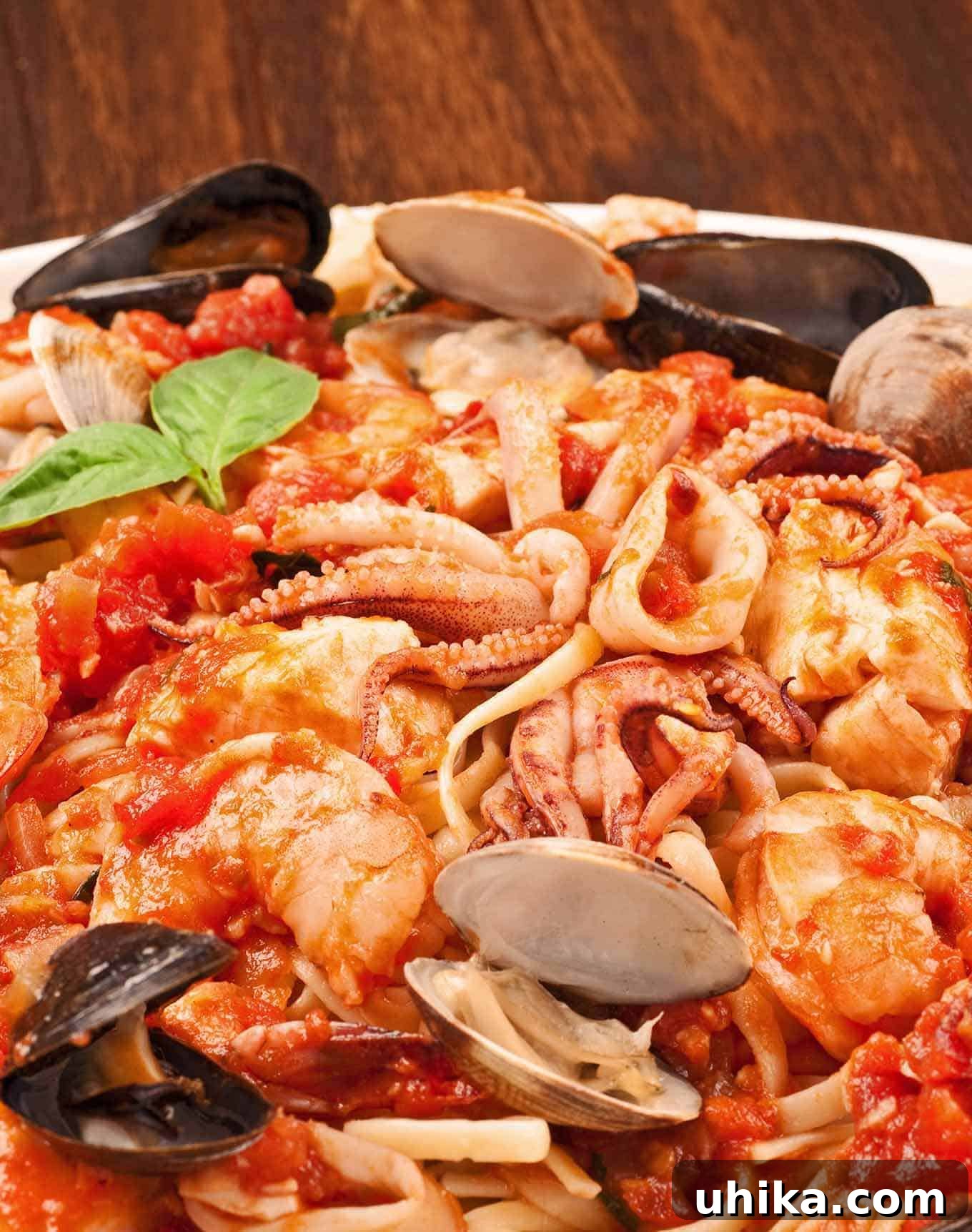 Ocean's Bounty Linguine 2 A vibrant plate of linguine pasta generously topped with an exquisite medley of fresh seafood in a rich, aromatic tomato sauce, garnished with bright green basil leaves, inviting a delightful culinary experience.