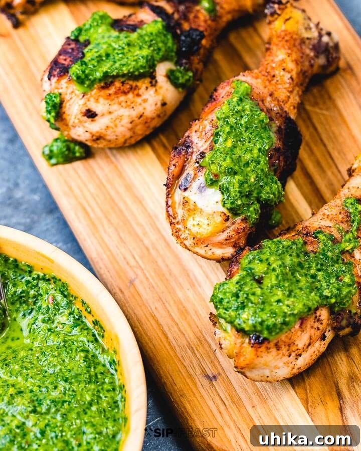 Salsa Verde with Grilled Chicken - Delicious! Italian green sauce on three chicken legs. A vibrant green salsa verde drizzled over grilled chicken.