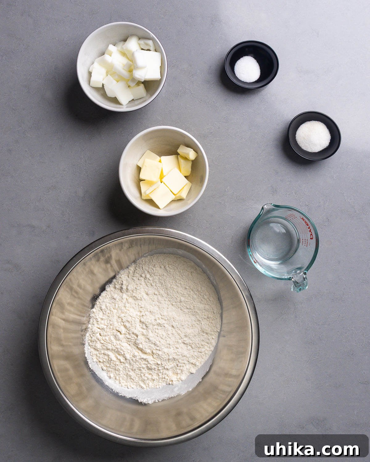 Timeless Flaky Apple Pie 4 Pie crust ingredients shown: lard, butter, salt, sugar, water, and flour.