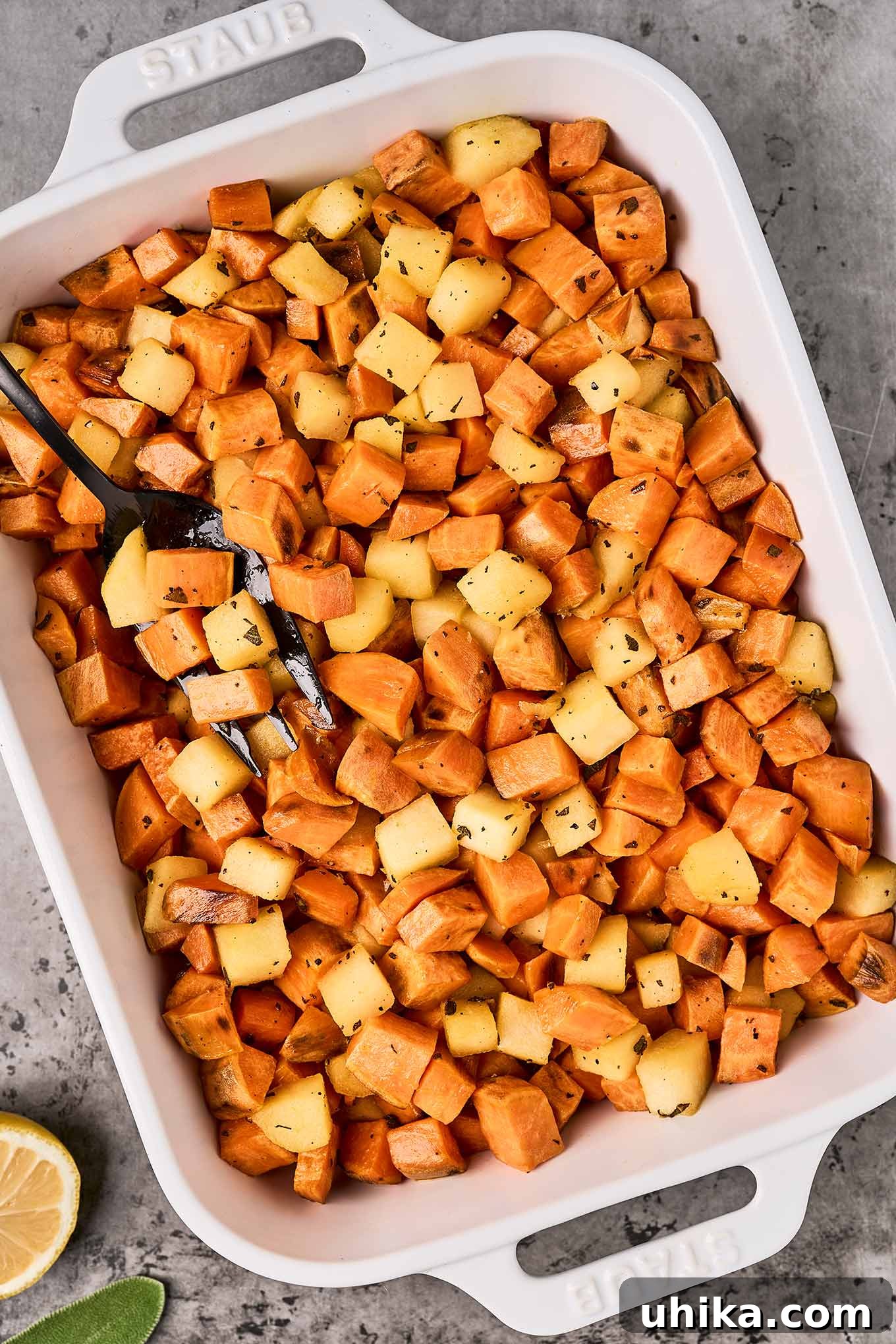 Caramelized Sweet Potato & Apple Gems 6 Roasted sweet potatoes and sautéed apples in a casserole dish, ready for baking.
