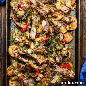 Sticky ribs with crispy potatoes in large sheet pan.
