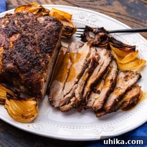 Large platter with sliced Italian roasted pork shoulder.