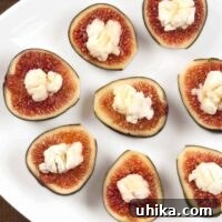 Fig and Goat Cheese Delights 3 A serving plate filled with fresh figs stuffed with creamy goat cheese.