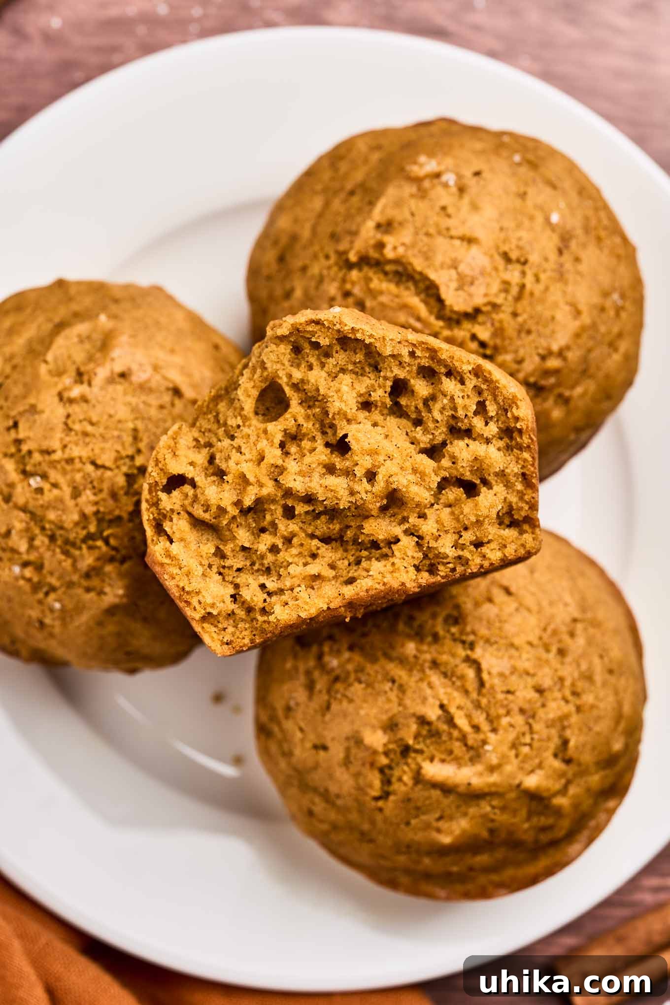 Cozy Pumpkin Spice Bites 8 A plate of autumn-inspired pumpkin spice muffins made with fragrant spices and pumpkin puree, perfect for fall baking.