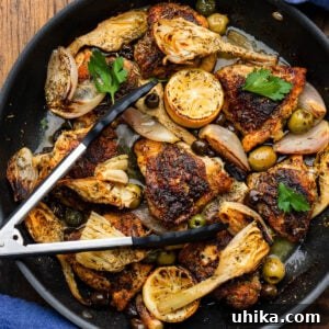Chicken Provencal in large black pan.