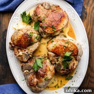Large white platter with Italian stuffed pork chops.
