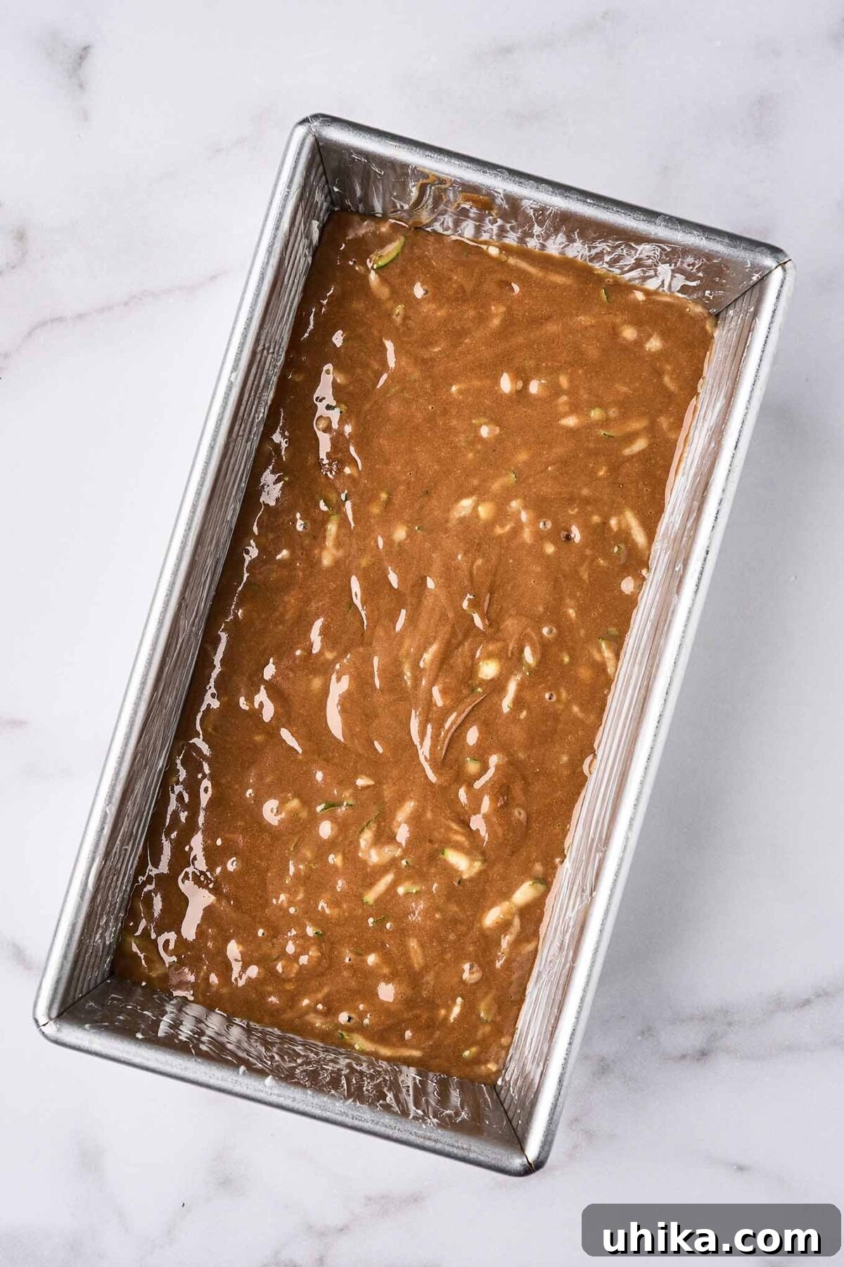 Double Chocolate Zucchini Loaf 6 Chocolate zucchini bread batter in a greased loaf pan, ready for the oven.
