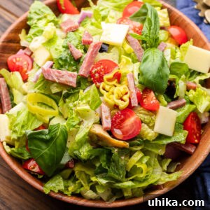 Italian chopped salad in a rustic wood bowl, perfect for sharing.