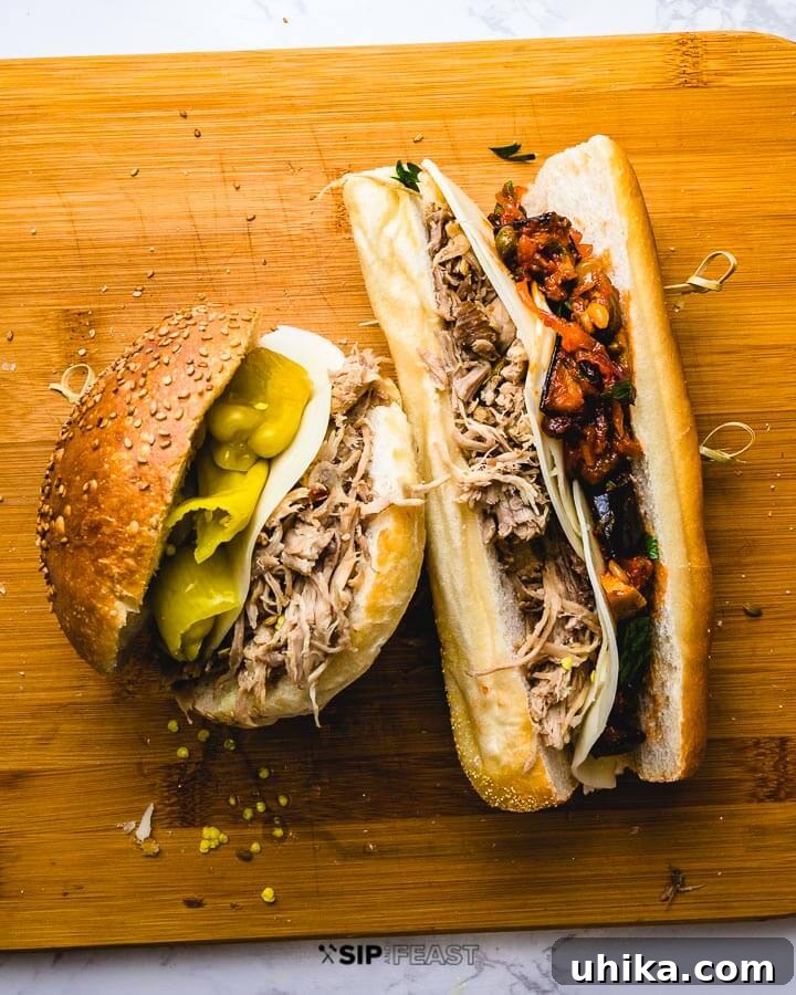 Two Shredded pork sandwiches. One with provolone and Tuscan peppers, the other with caponata. Creative serving suggestions for pulled pork.