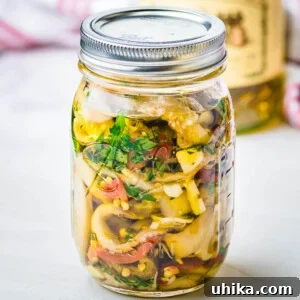 Italian pickled eggplant in glass jar.