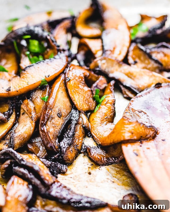 Sauteed Balsamic Portobello Mushrooms - sipandfeast.com #sidedish #italianfood #mushrooms Perfectly browned and glossy sauteed portobello mushrooms with balsamic vinegar in a pan, ready to serve.