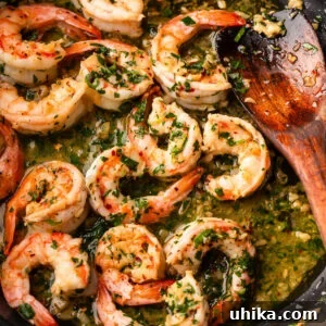 Effortless Garlic Shrimp Delight 8 Large black pan with shrimp scampi.