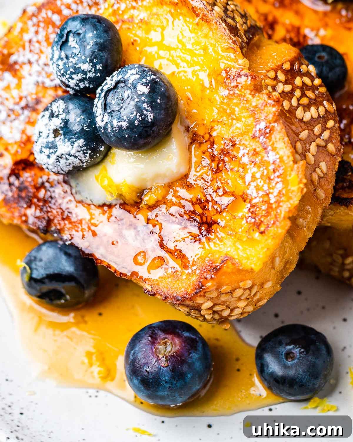 Dreamy Lemon Blueberry French Toast 2 Exquisite Lemon Blueberry French Toast served with a pat of butter and golden maple syrup, ready for a perfect breakfast or brunch.