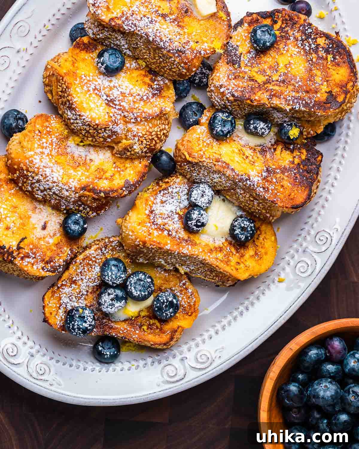 Dreamy Lemon Blueberry French Toast 5 A large platter showcasing a generous serving of Lemon Blueberry French Toast, garnished with fresh berries.