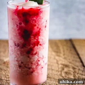 Molten Raspberry Colada 9 Raspberry Colada Cocktail with fresh pineapple and lime juice. A raspberry puree is added to the coconut milk and rum cocktail.